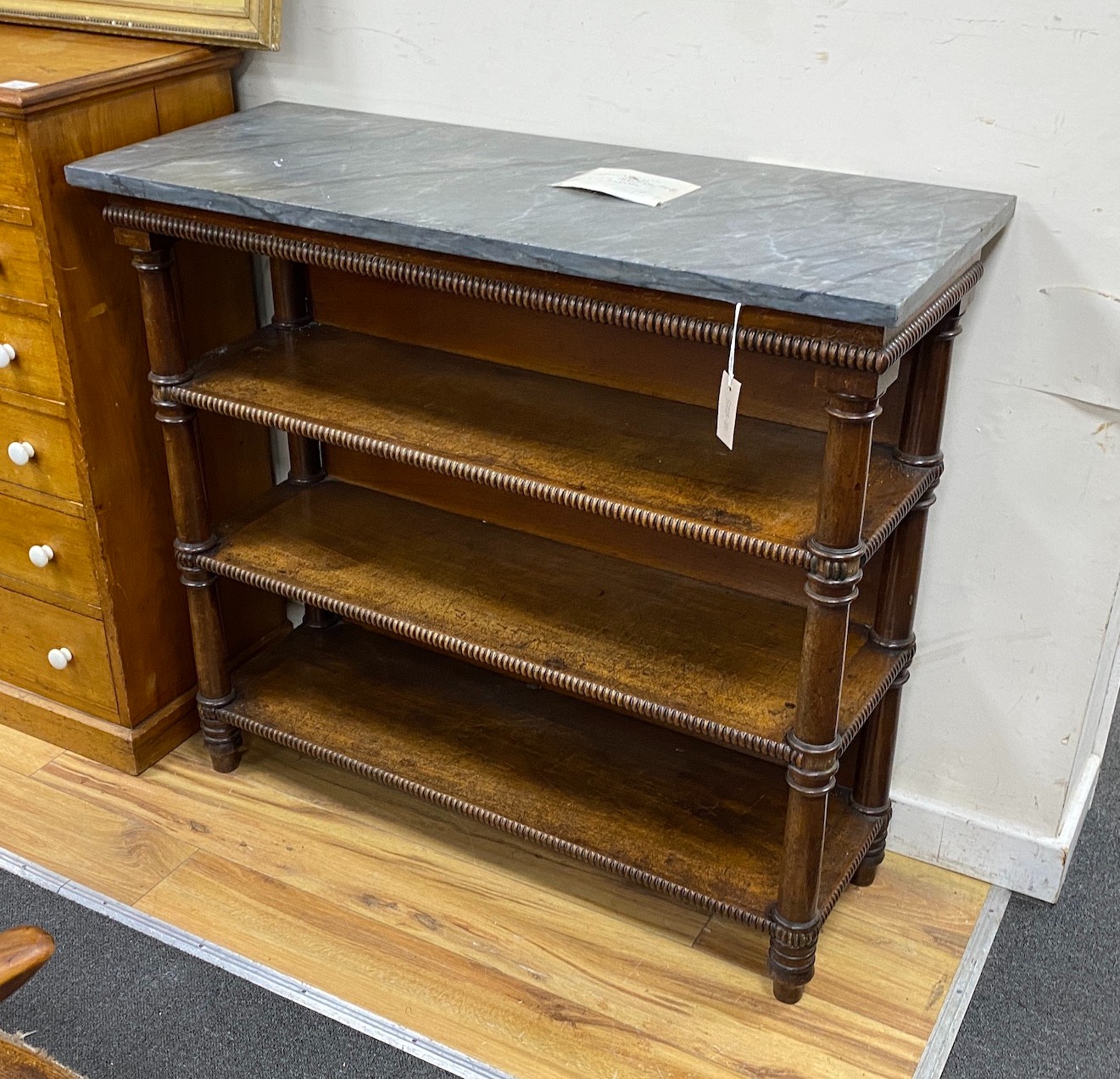 An early Victorian later marble topped mahogany bookcase, length 103cm, depth 41cm, height 92cm